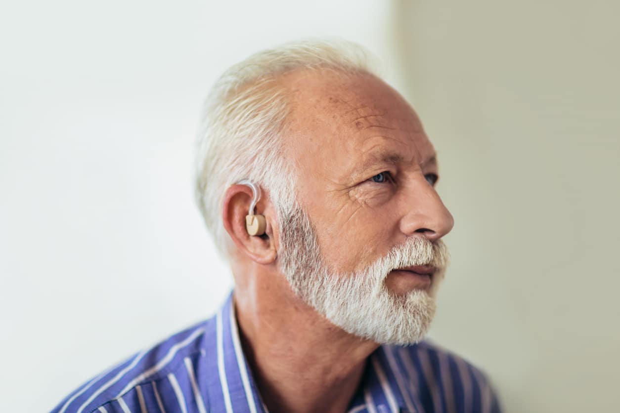 Senior man wearing a hearing aid
