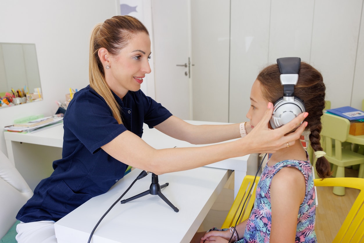 Young girl gets hearing tested